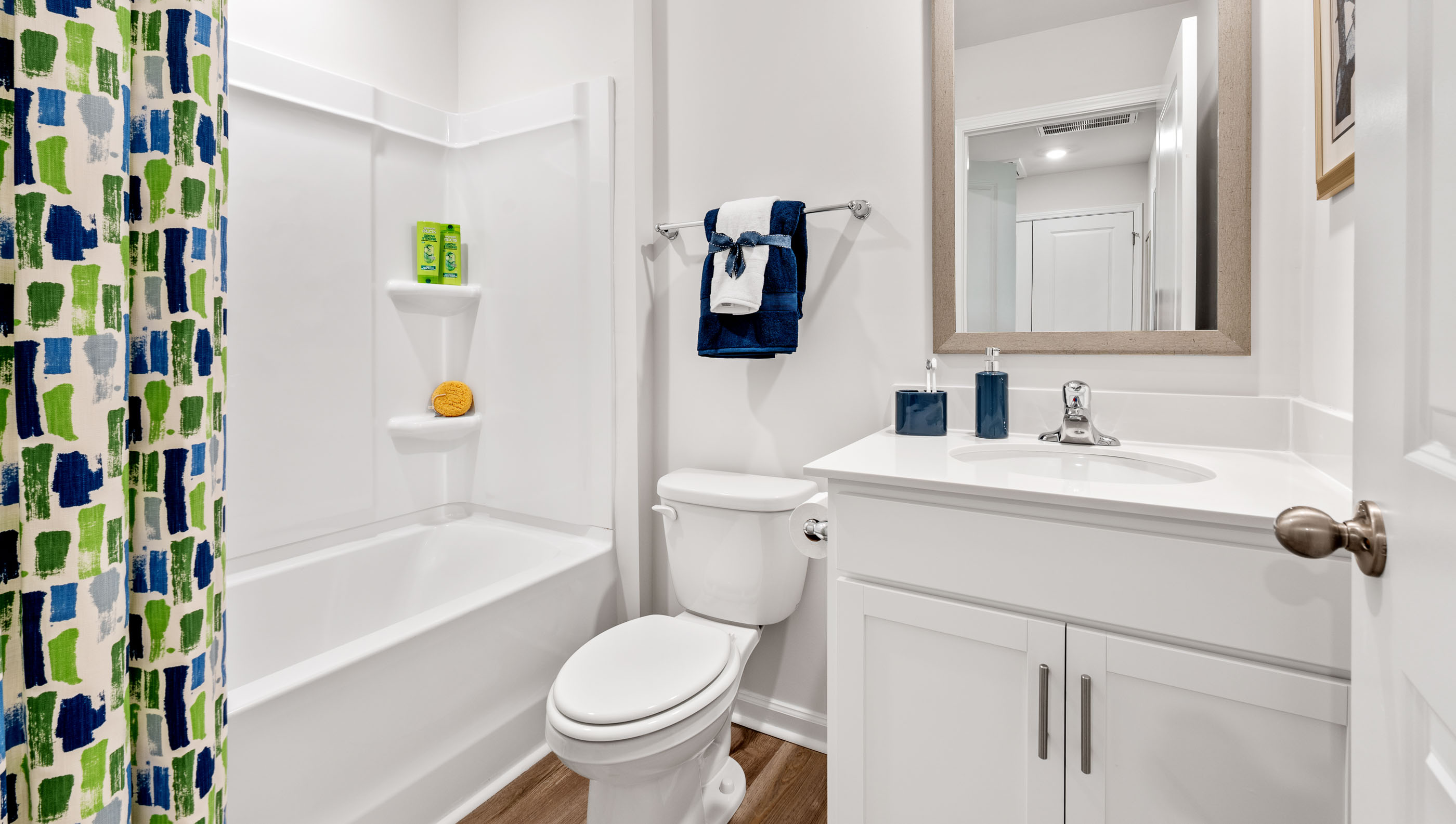 Bathroom with single vanity sink and tub.