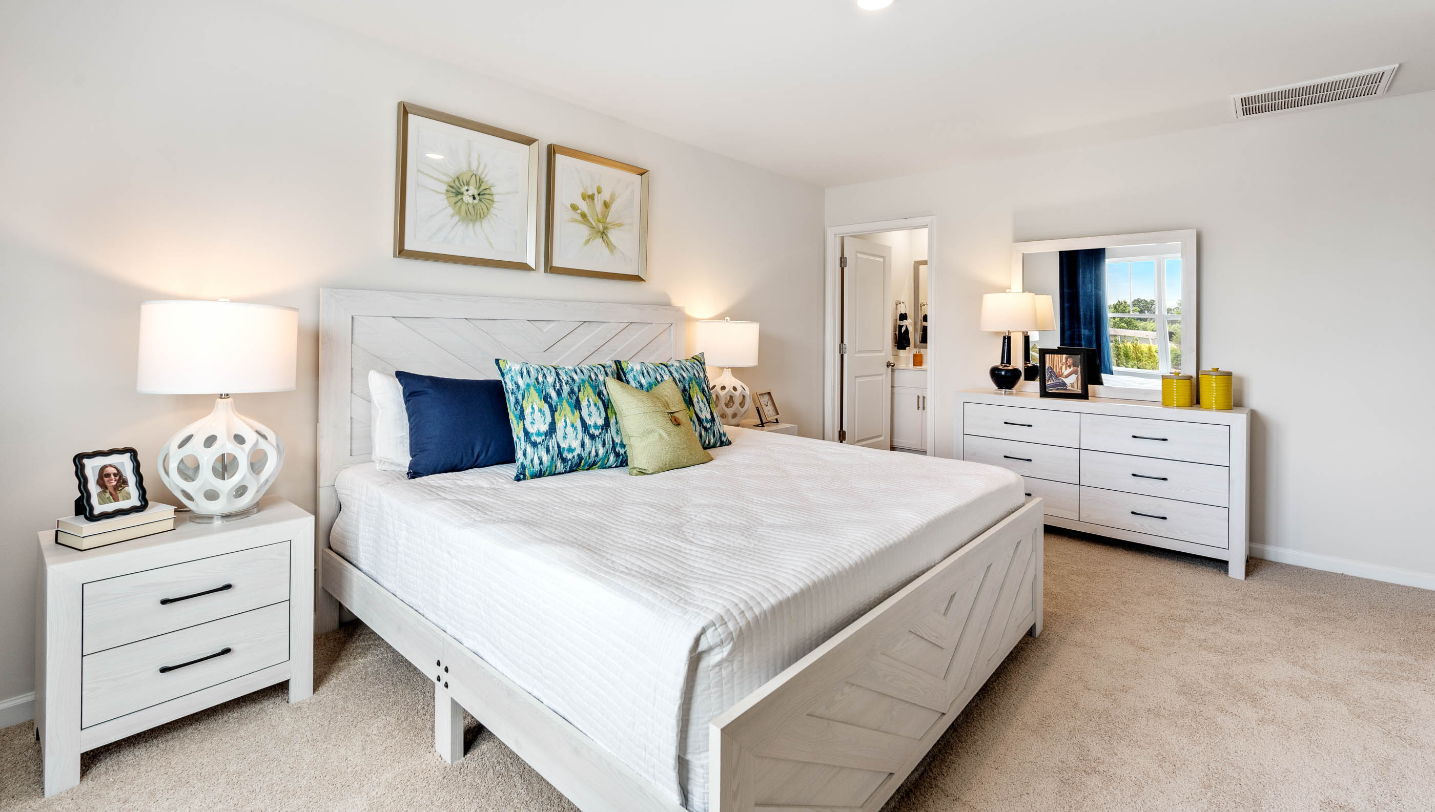 Bedroom with carpet and windows.