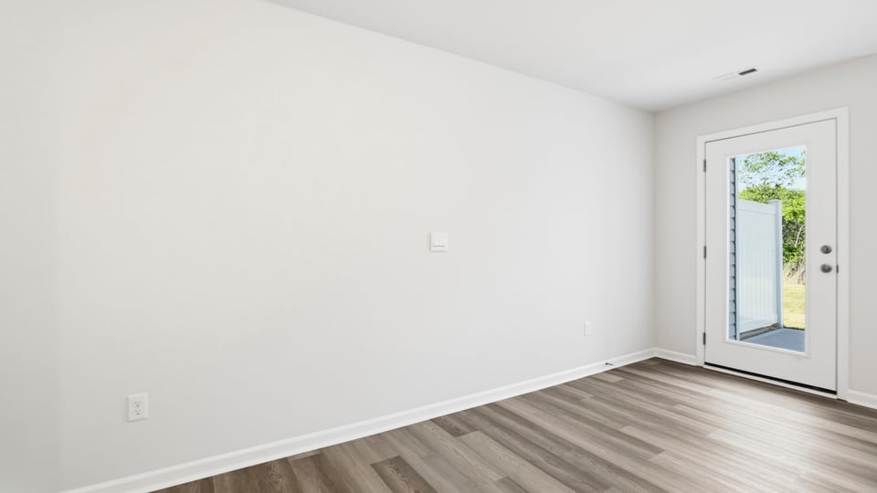 Livingroom with door to backyard.