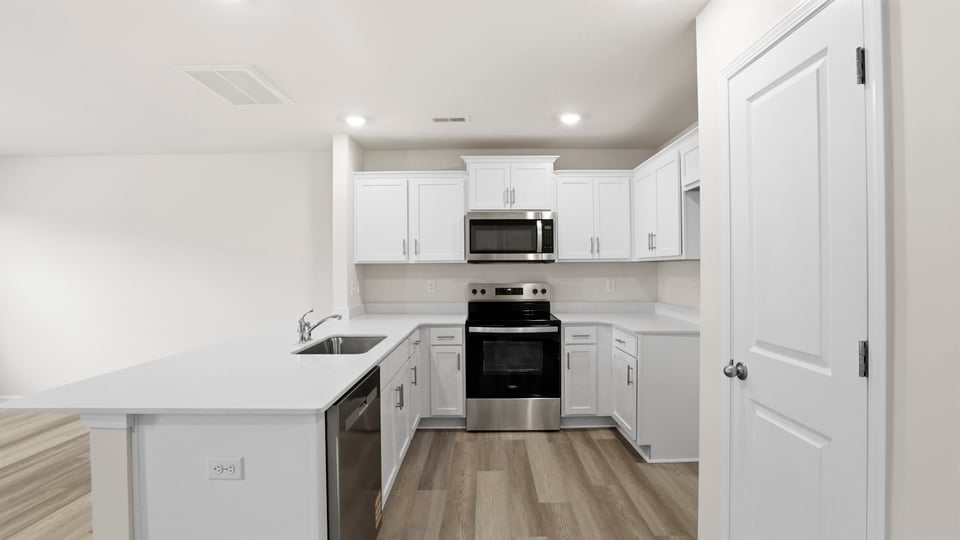 Kitchen with quarts countertops.