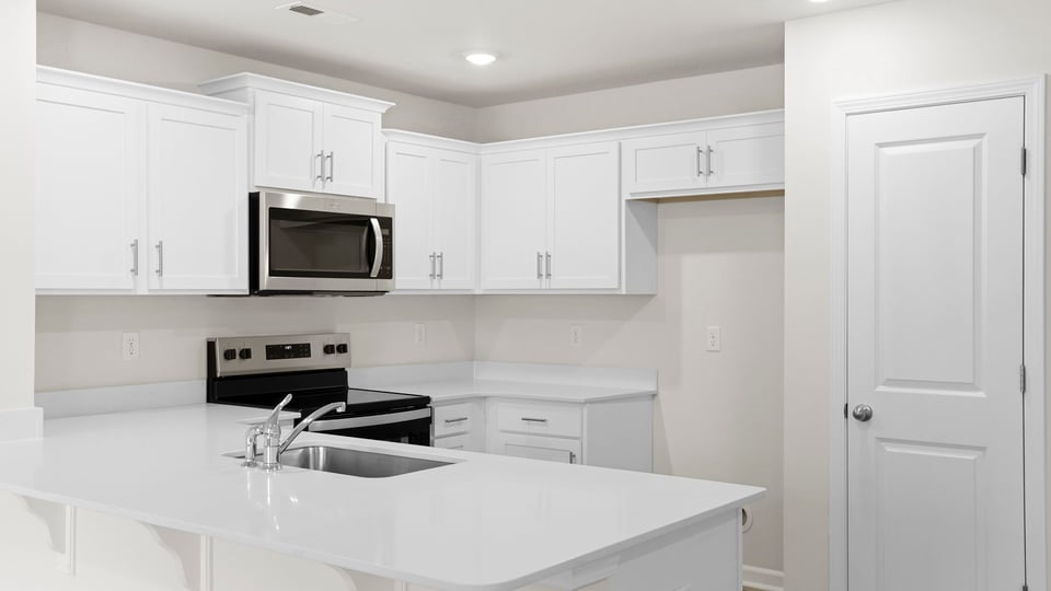 Kitchen with quarts countertops.