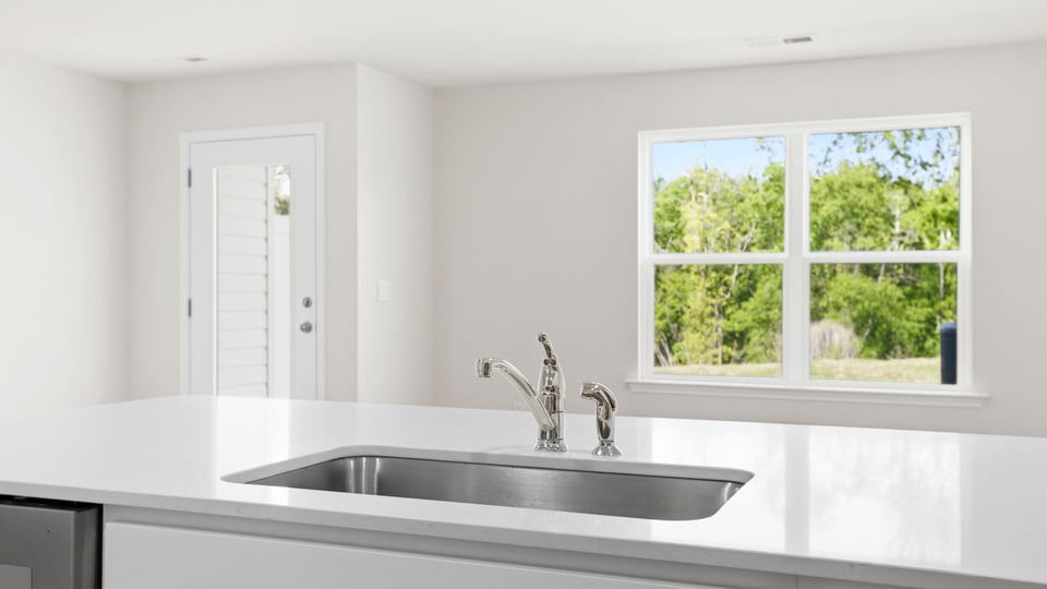 Kitchen with quarts countertops.