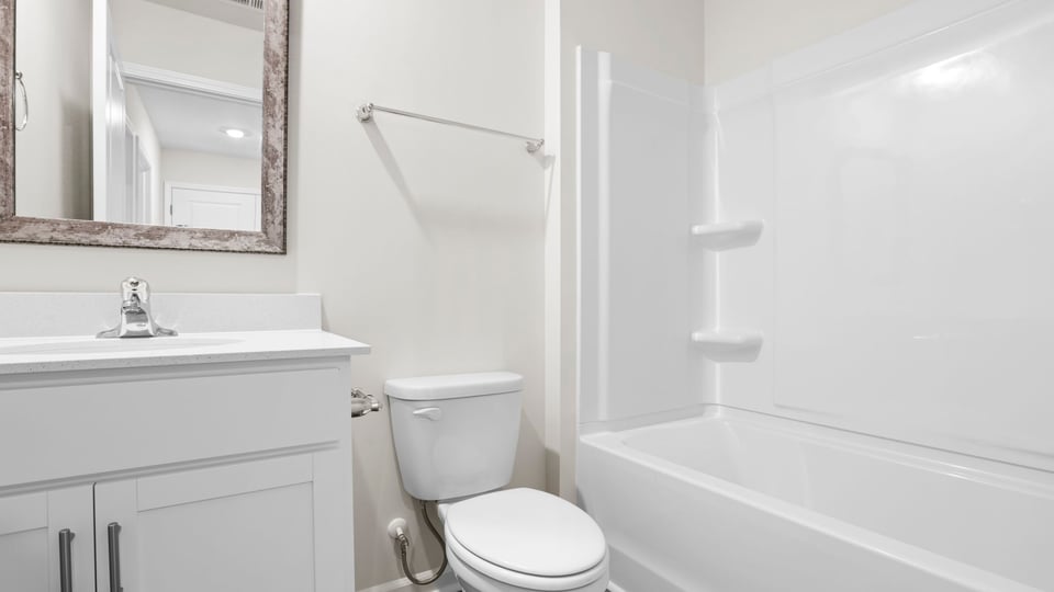 Bathroom with tub and vanity.