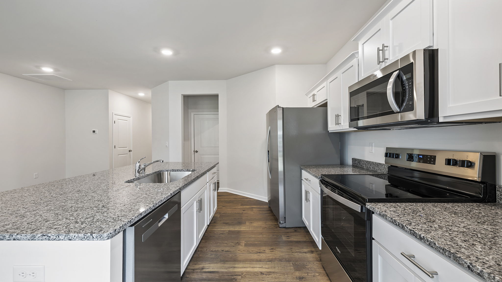 Kitchen with island and countertops.