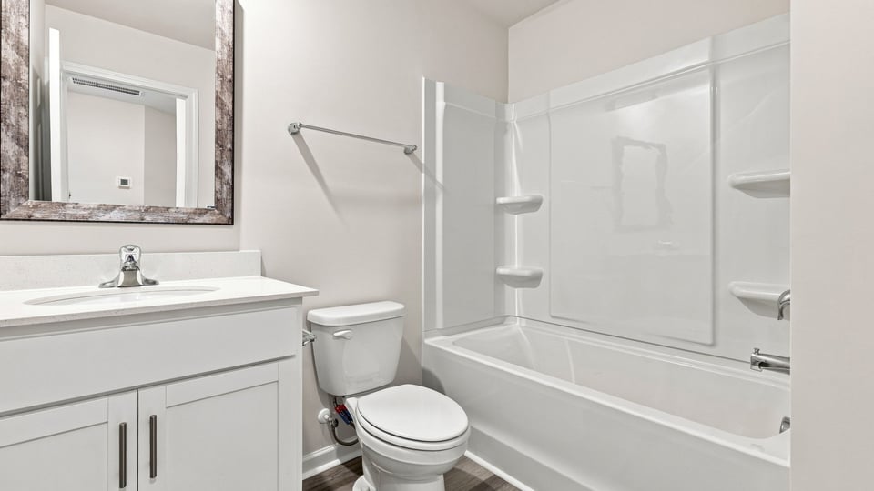 Bathroom with single vanity sink and bathtub.