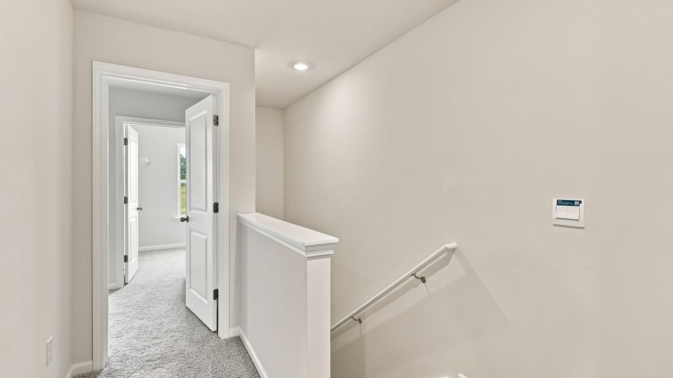 Loft area with carpet.