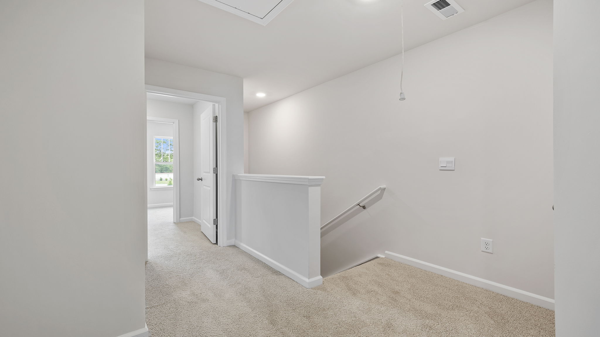 Bedroom with carpet and window.