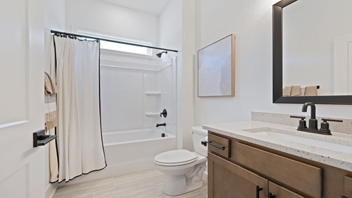 Bathroom with vanity sink and shower.