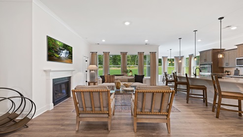 Living area with fireplace and windows.