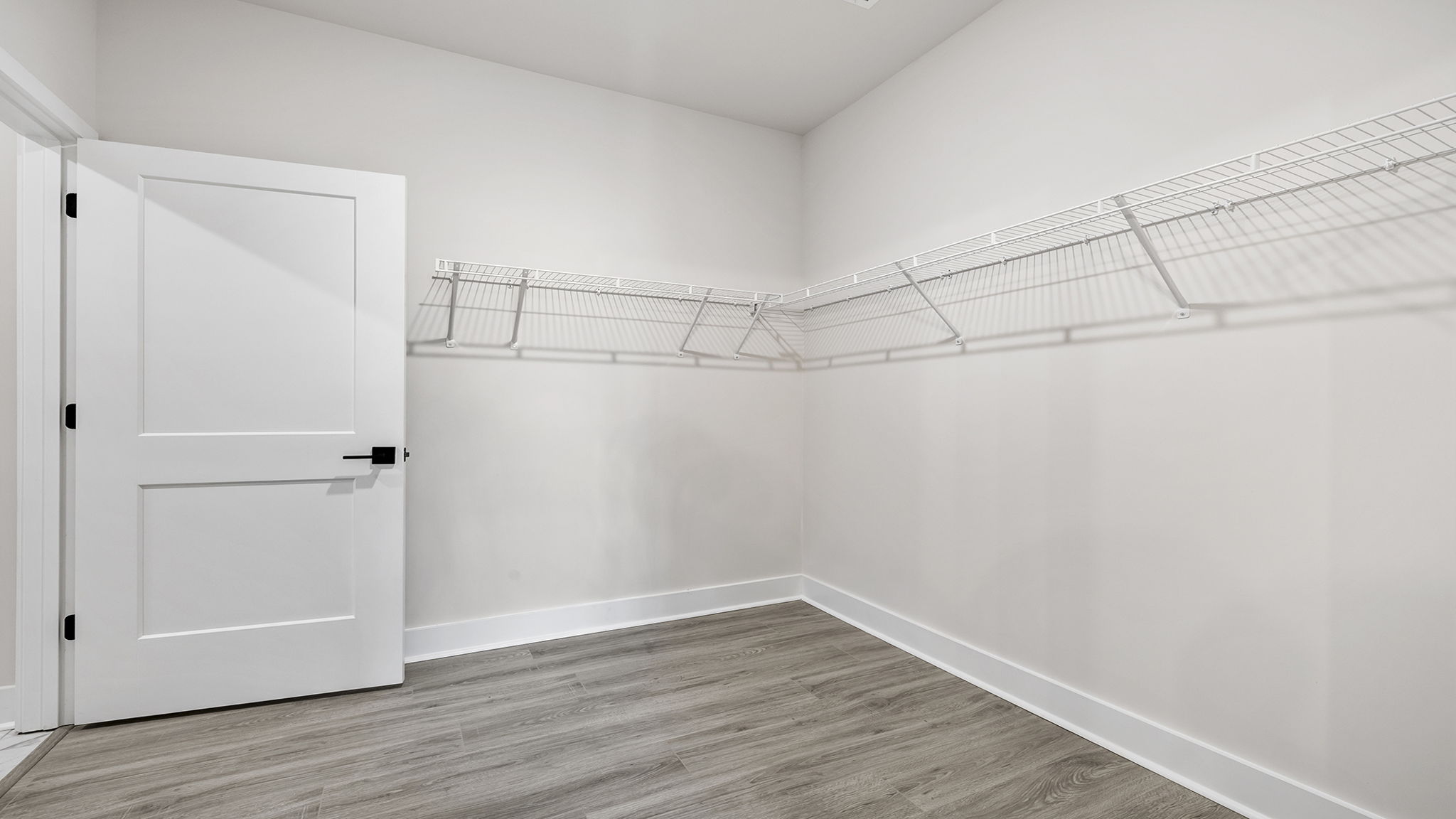 Primary bedroom walk-in closet.