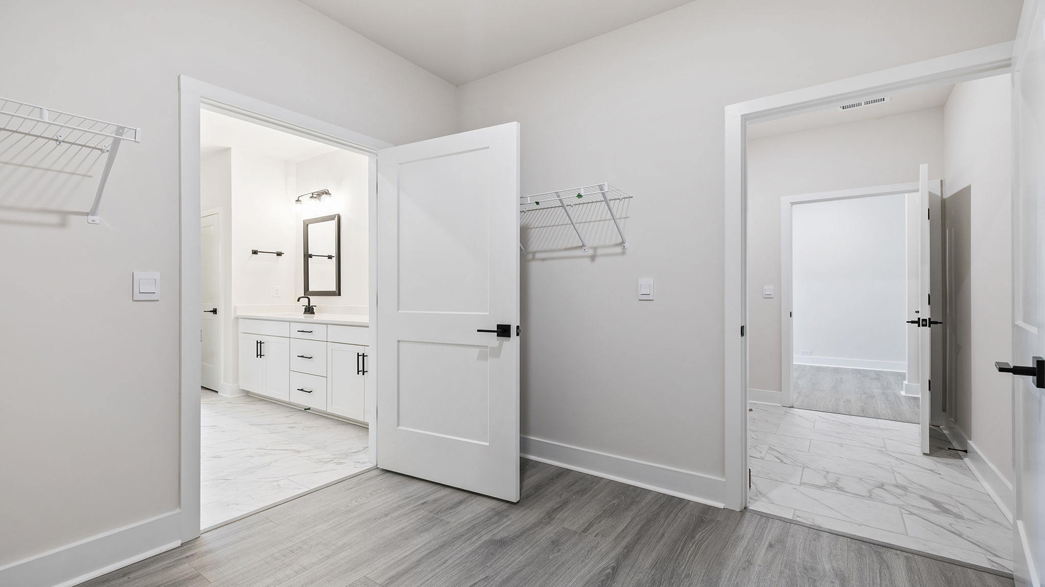 Primary bedroom walk-in closet.