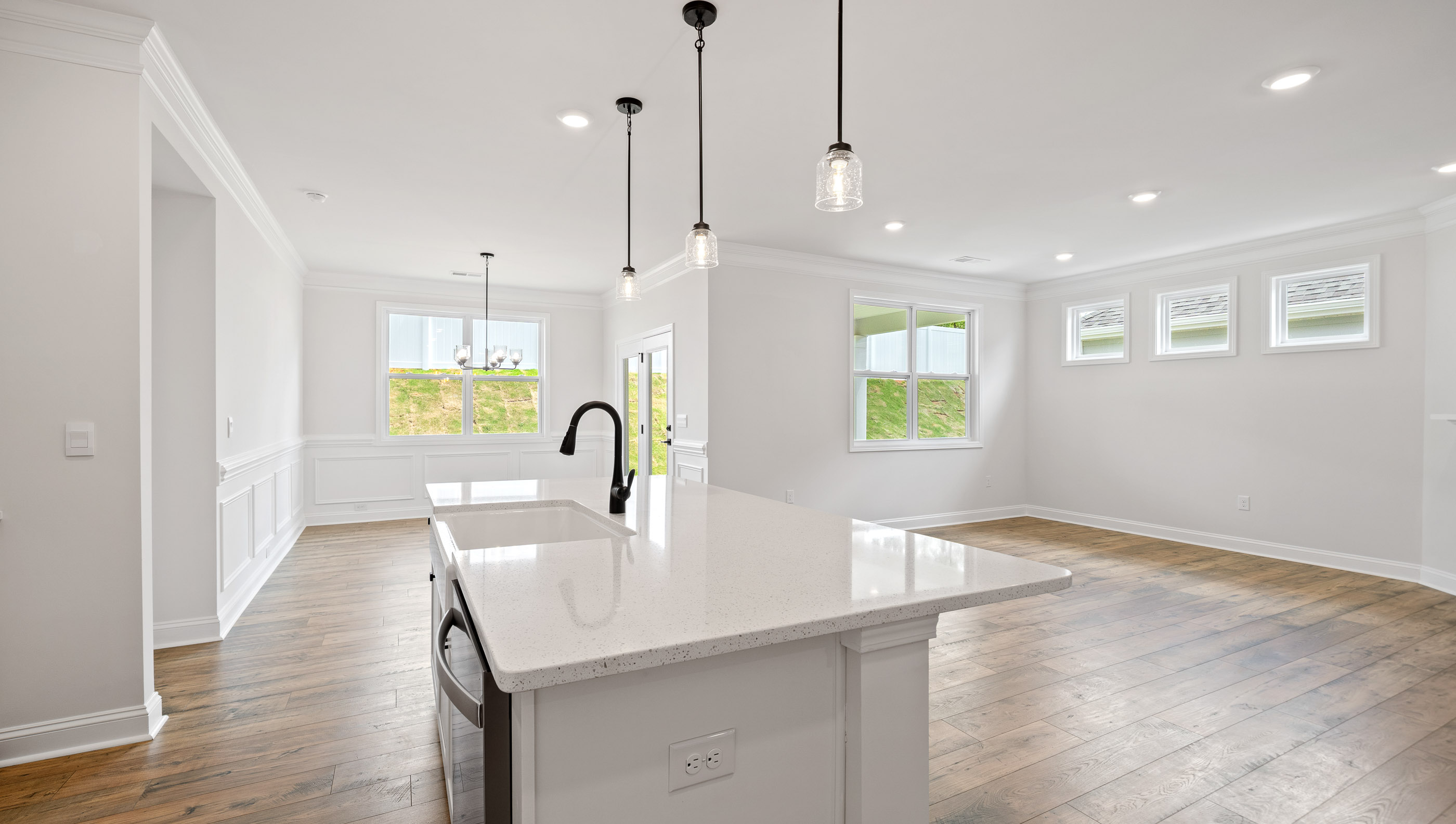 View of open floor plan with lots of windows.