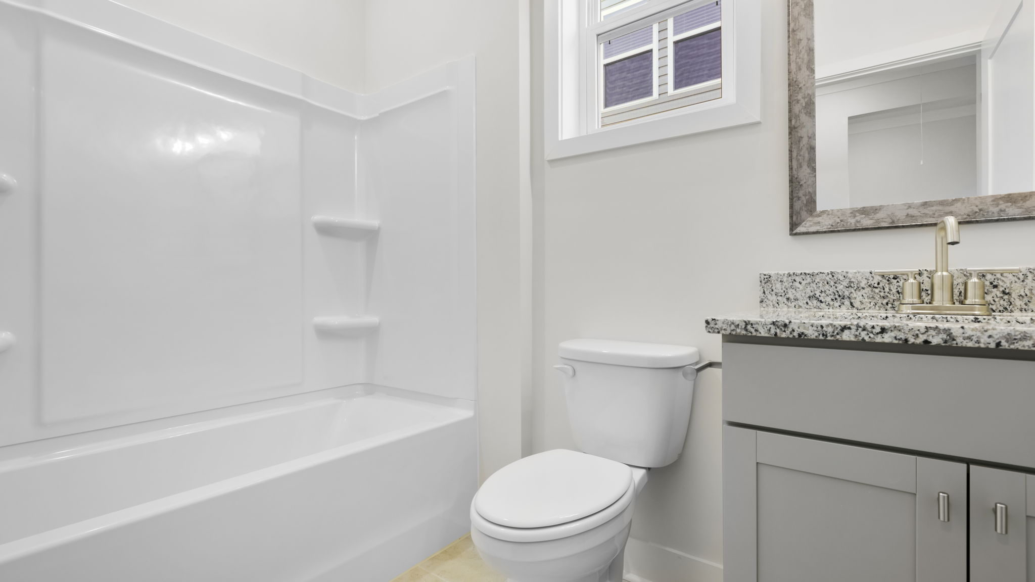 Bathroom with tub and single vanity sink.