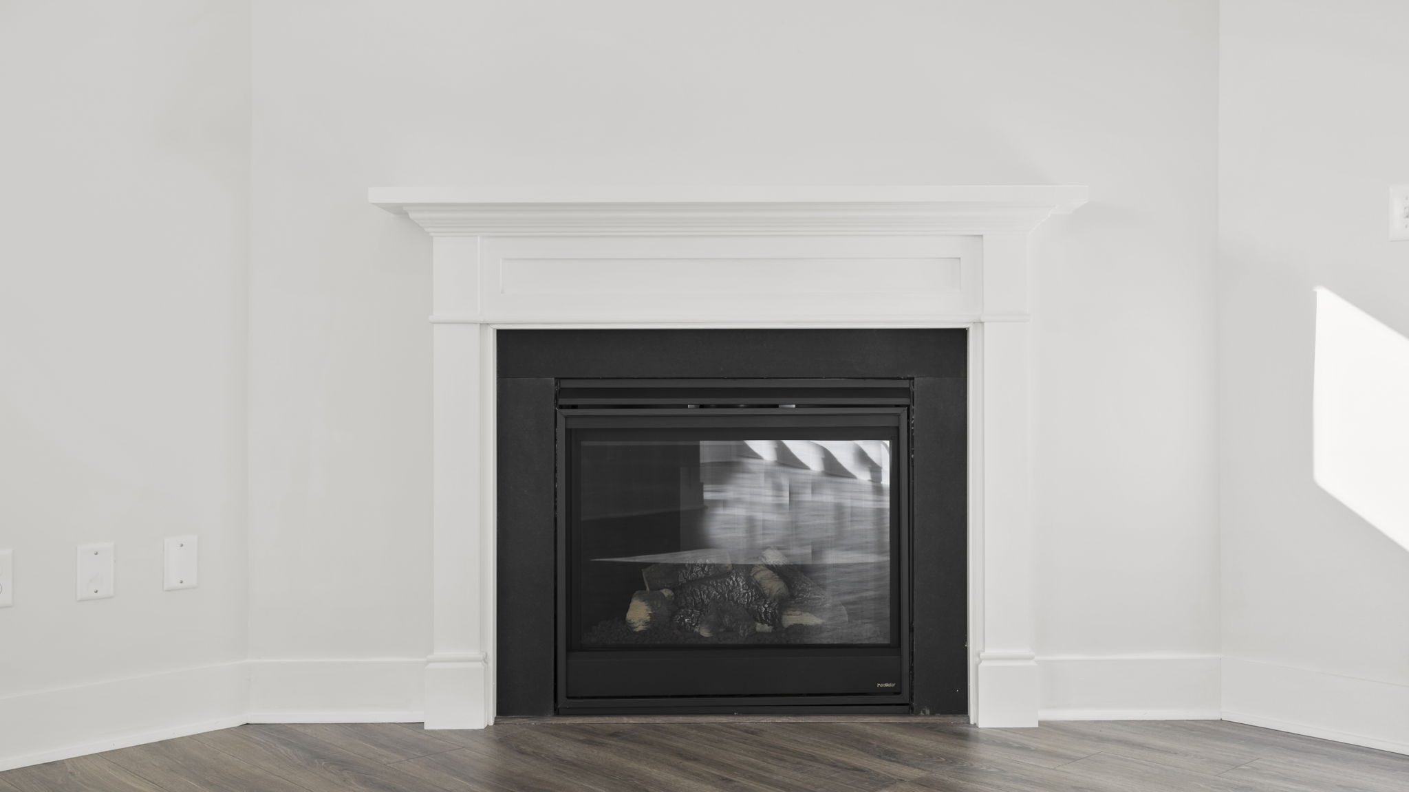 Family room with windows and fireplace.