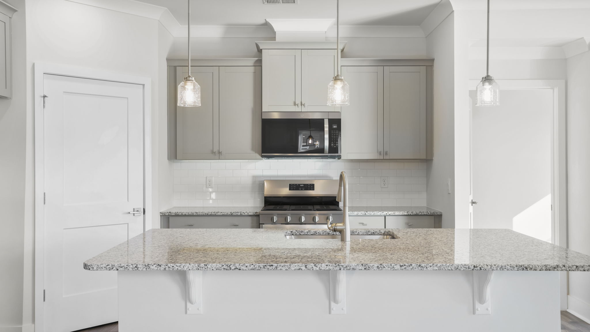 Kitchen with stainless steel appliances and quartz counter tops.