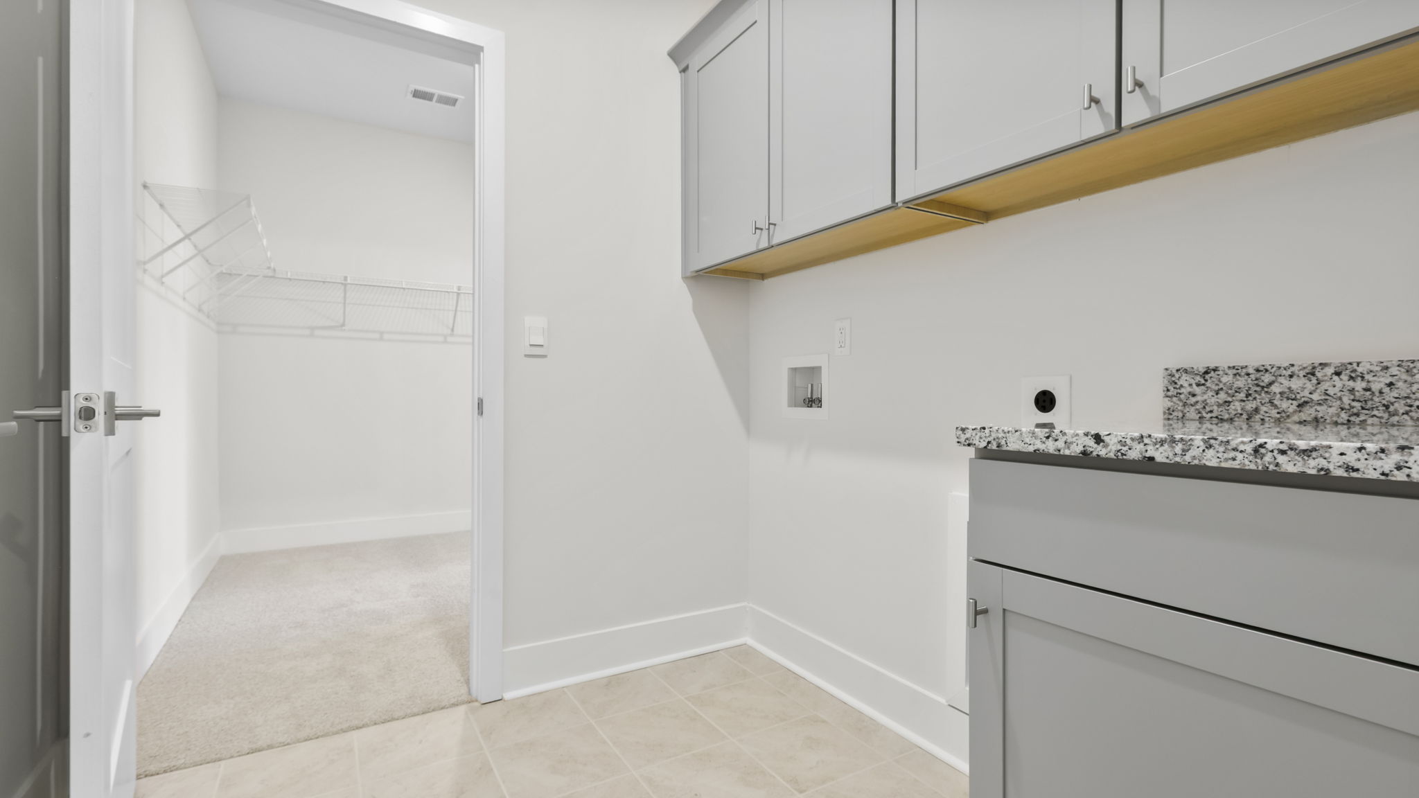 Laundry room with extra storage.