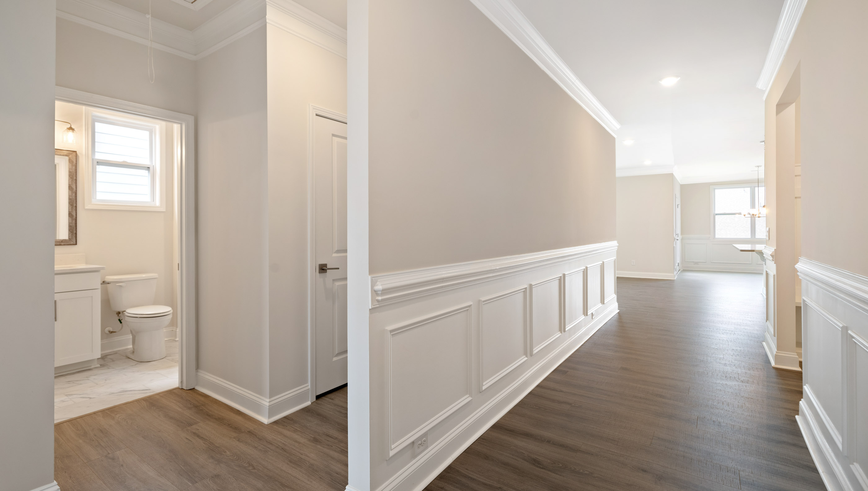 Entry way into home with view of rooms.