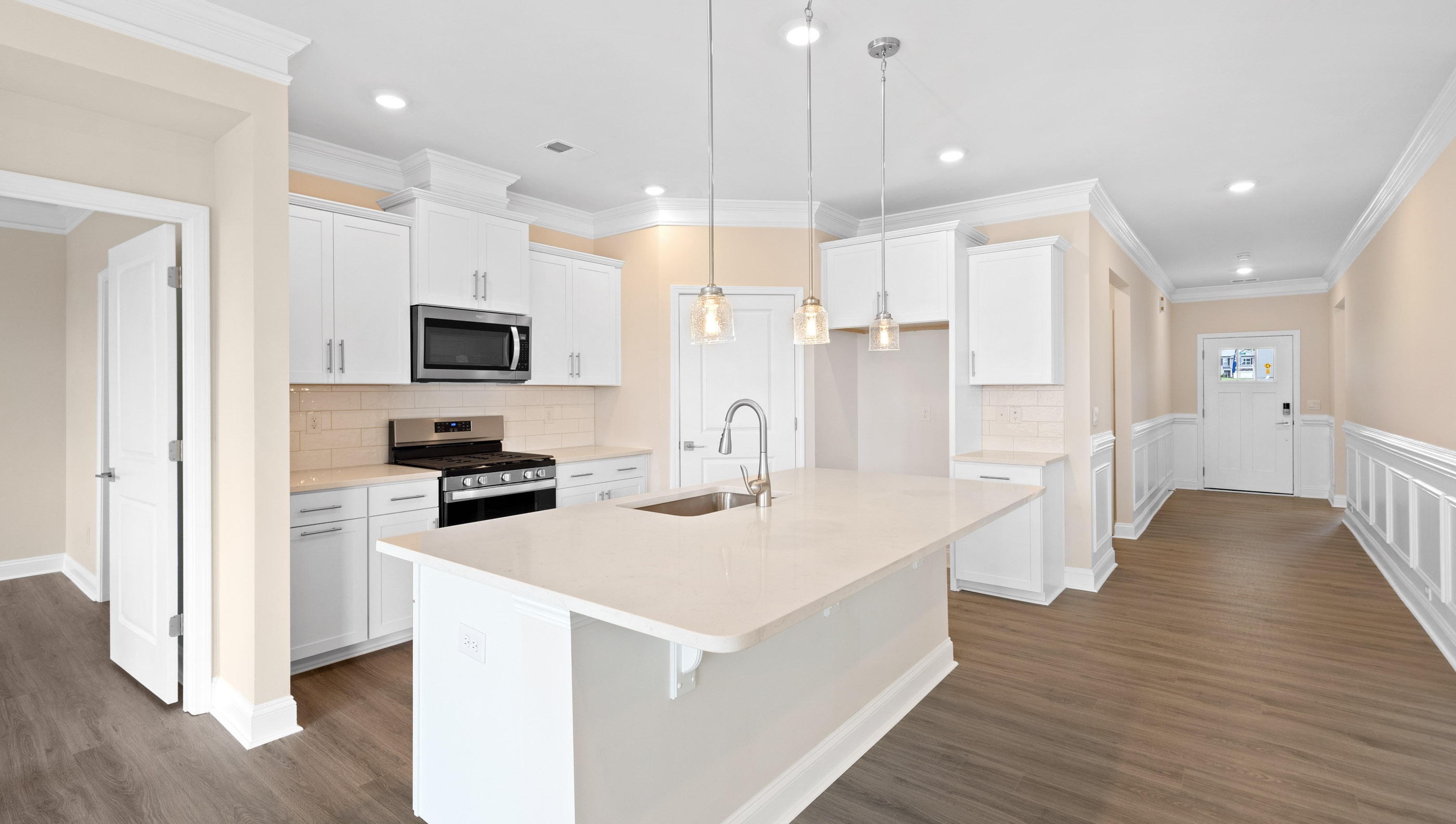 Kitchen and island with granite counter tops.