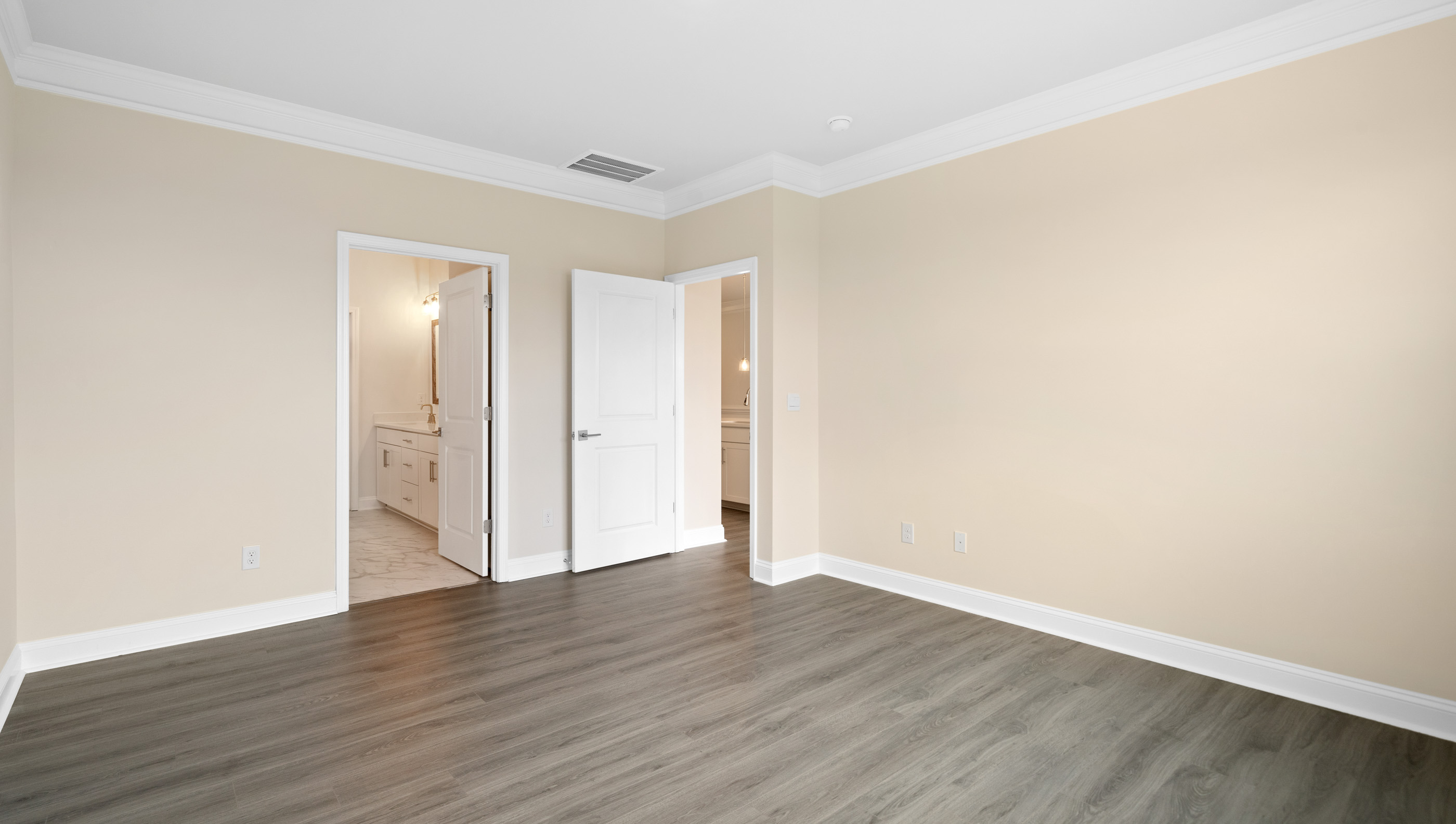 Bedroom with carpet and window.