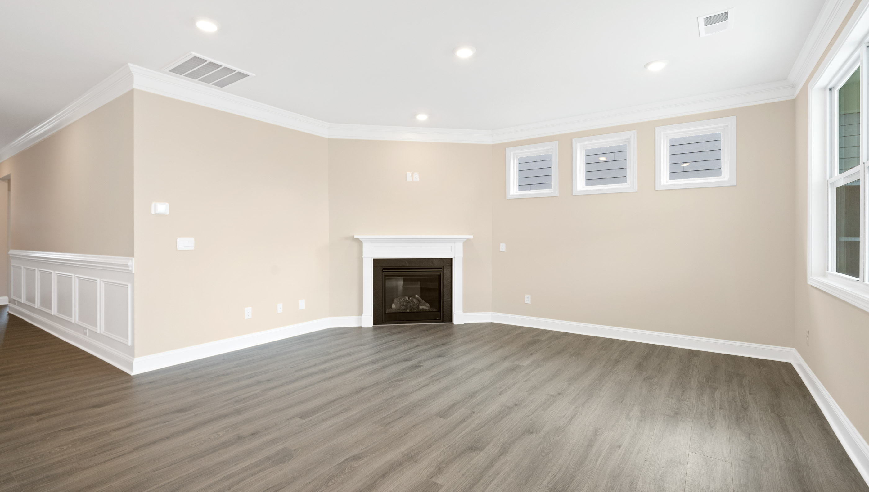Family room with fireplace and window.