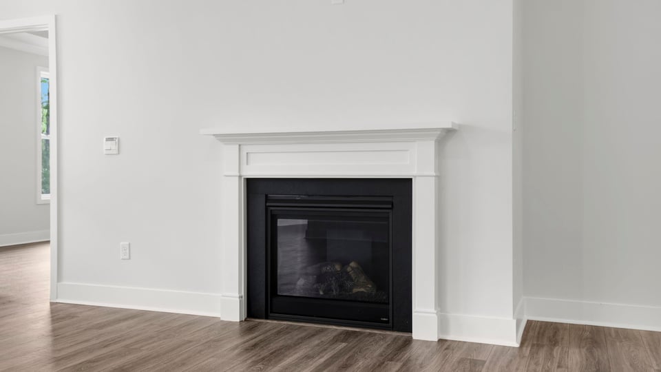 Family room with windows and fireplace.