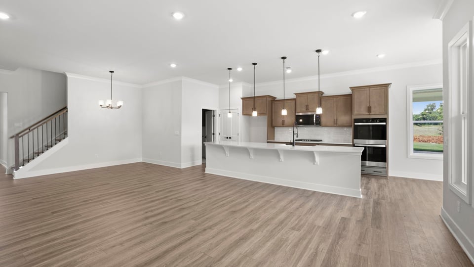 Kitchen and island with quartz countertops.