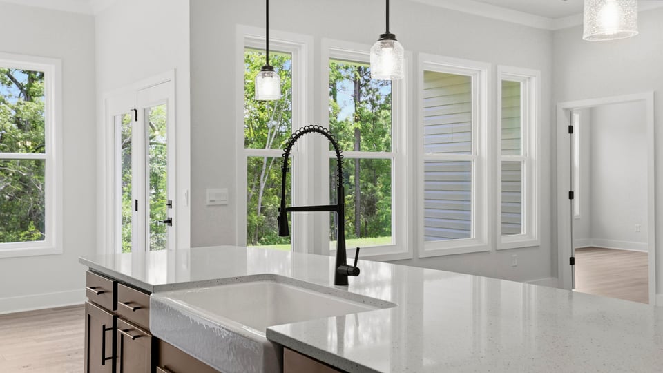 Kitchen and island with quartz countertops.