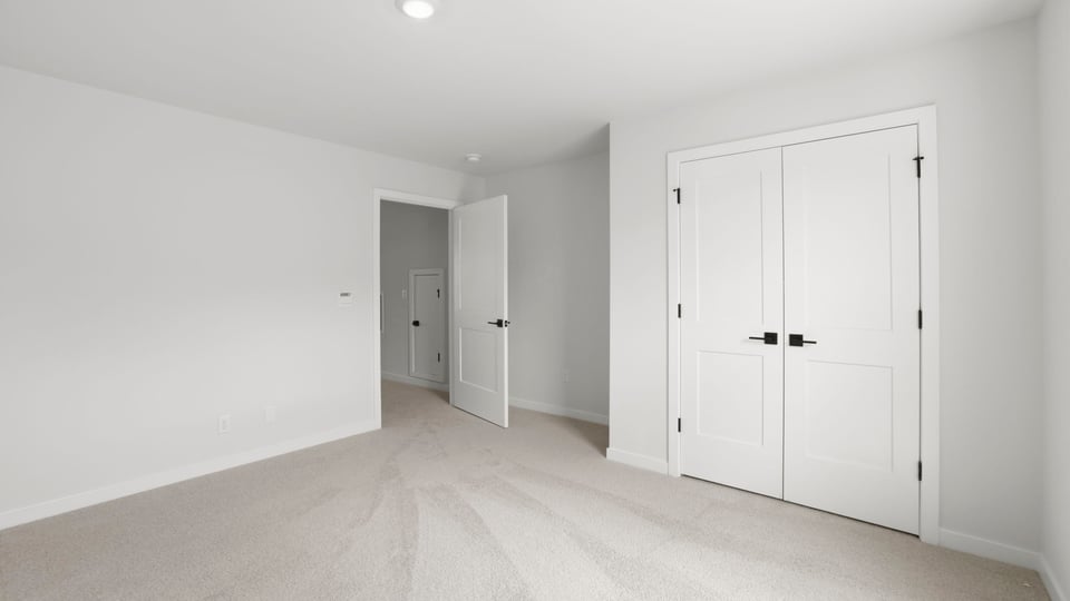 Loft area with carpet.