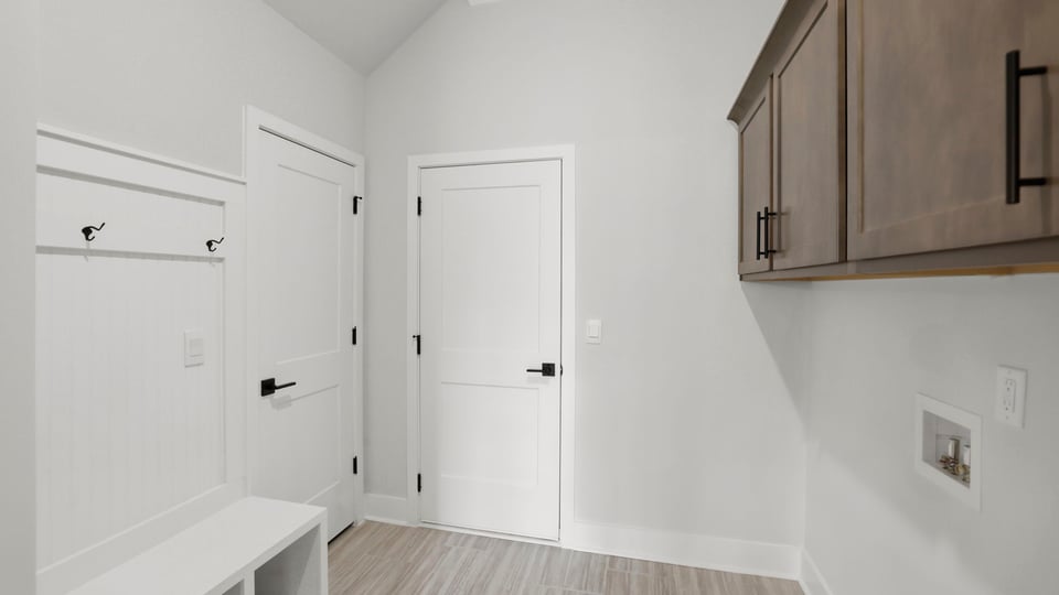 Laundry room with hanging storage racks.