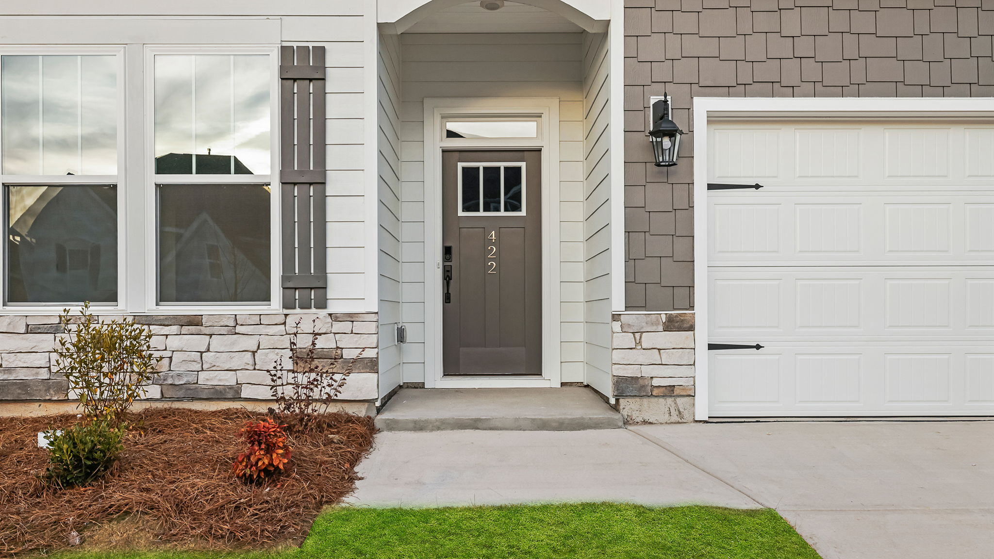 Inviting entry with stone accents.