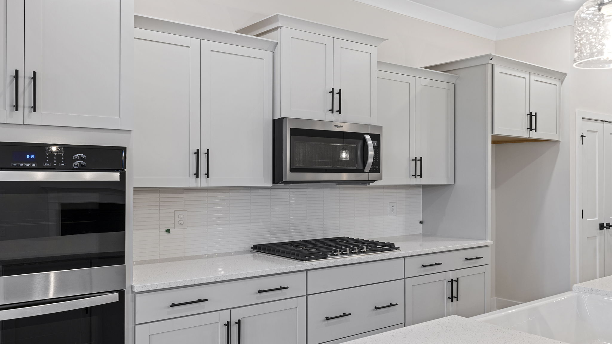 Gas stove top and built in microwave.