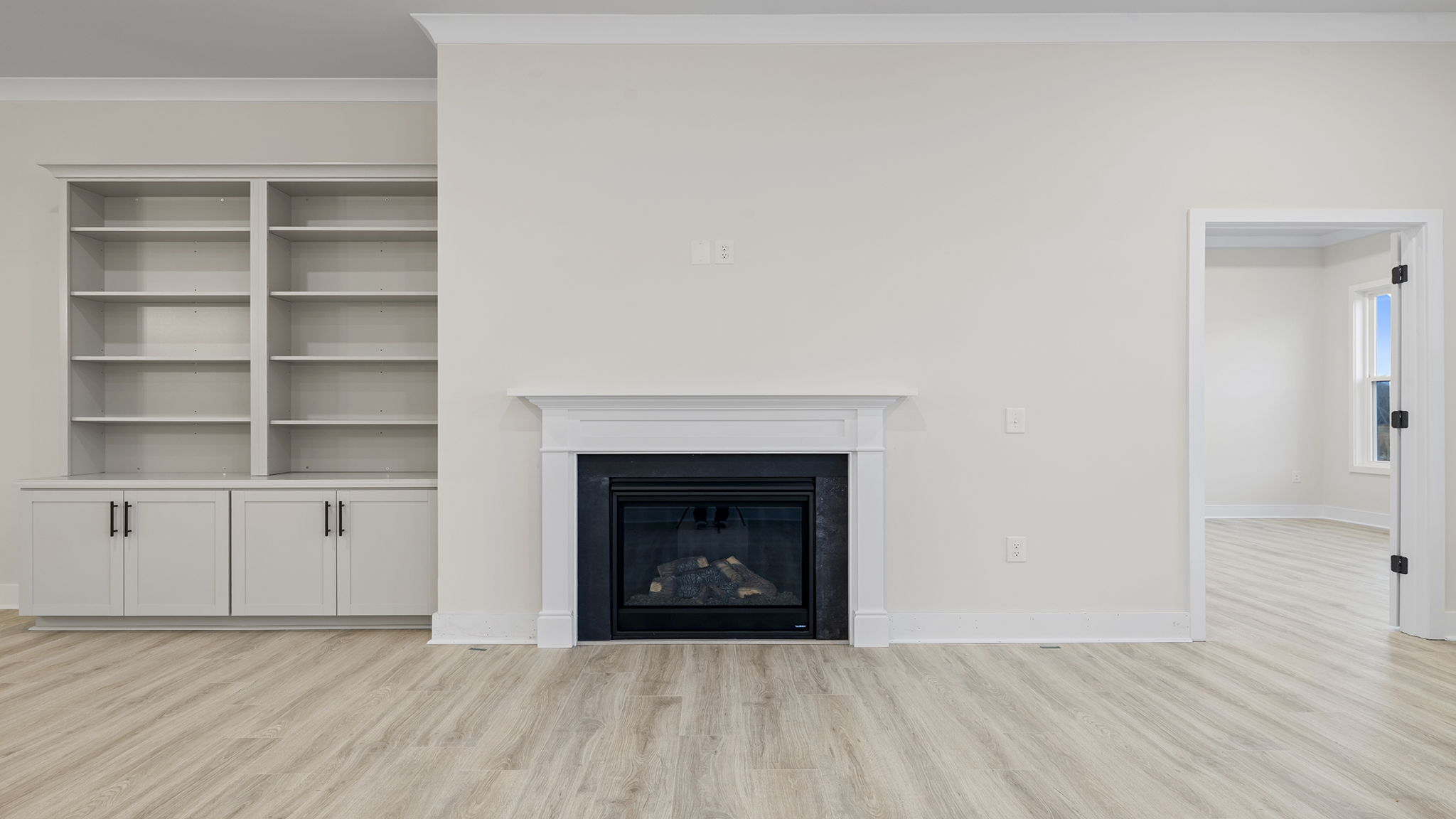 Family room with gas log fireplace.