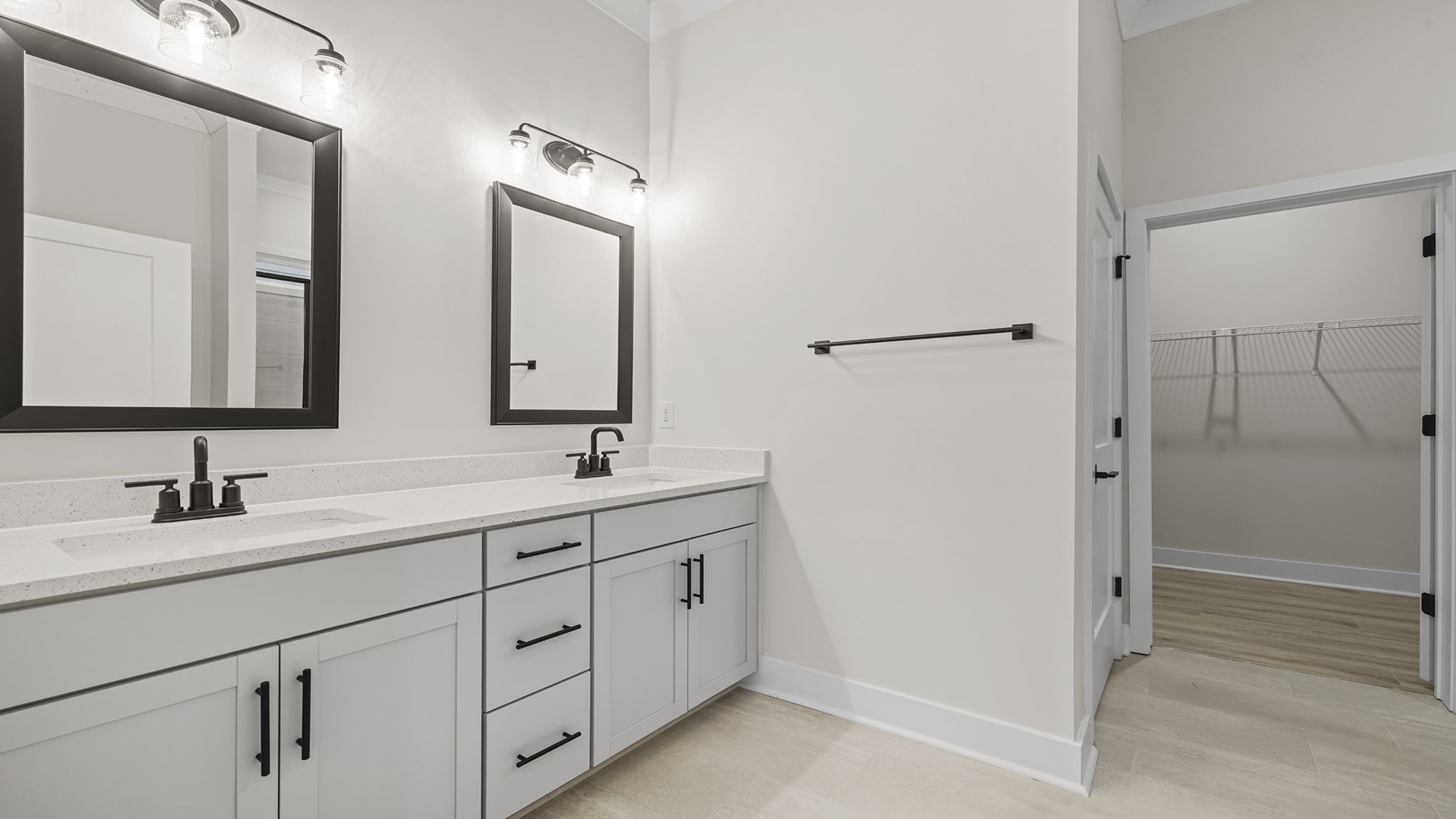 Primary bathroom with dual sink vanity.