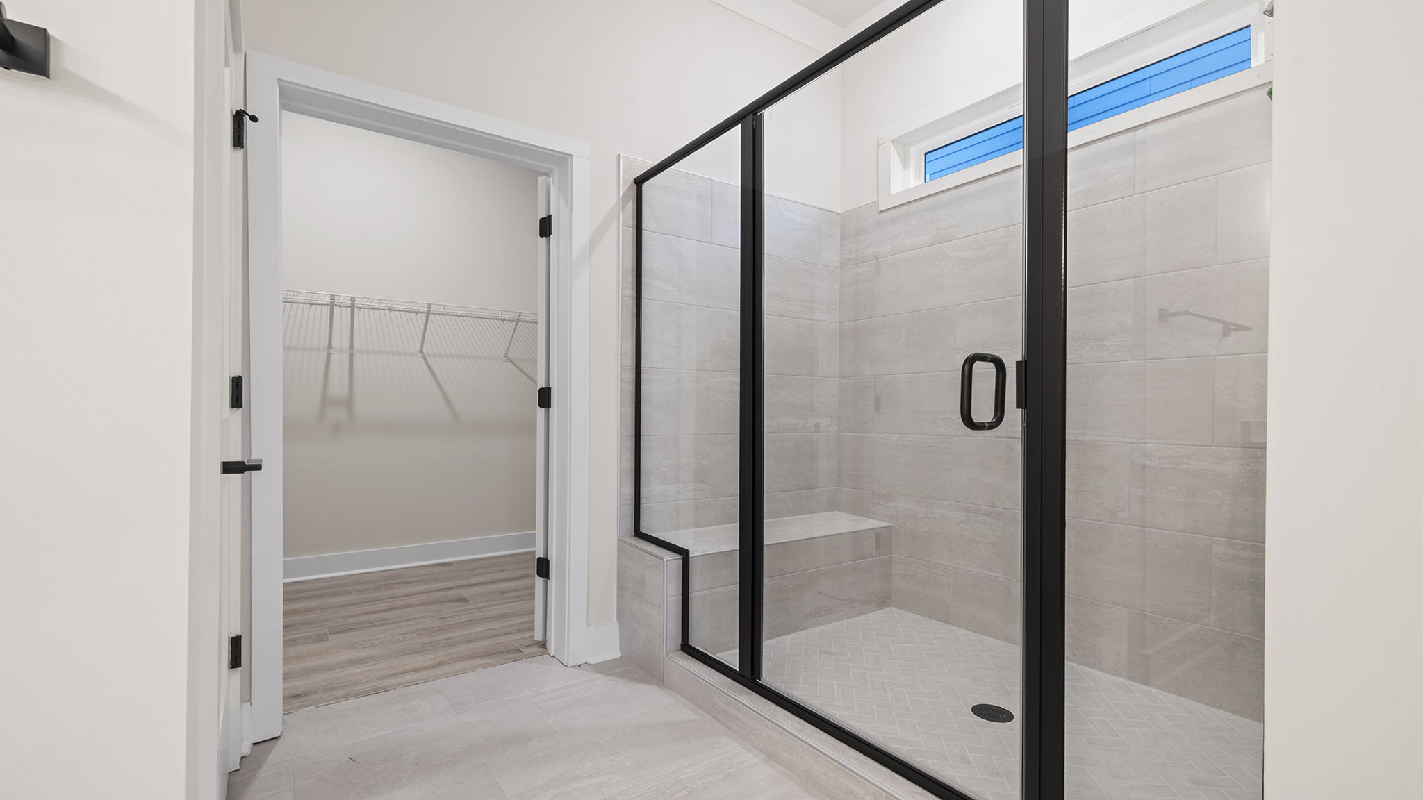 Primary bathroom with large walk-in shower.