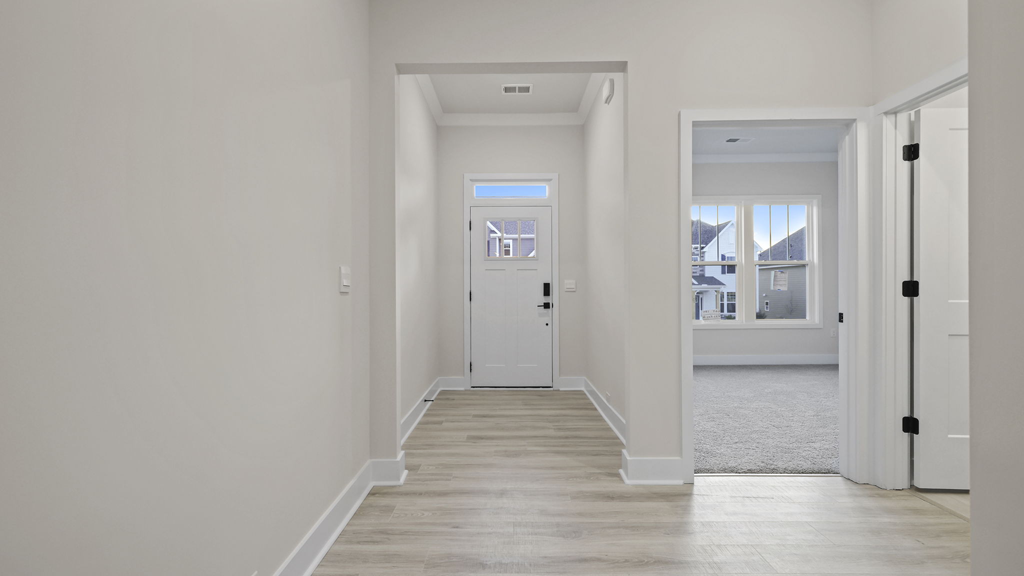 View of entrance and front bedroom.