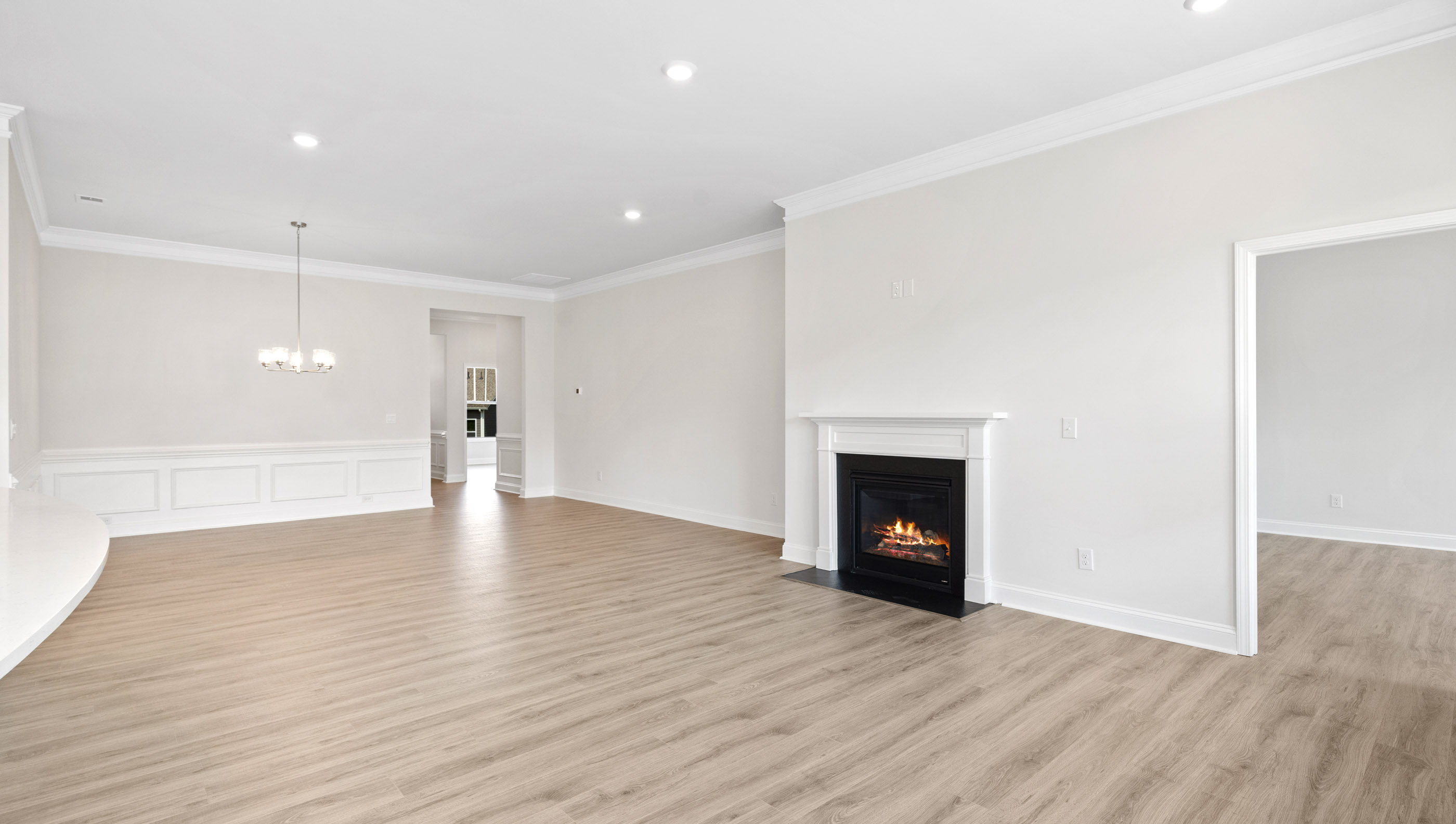 Family room with windows and fireplace.