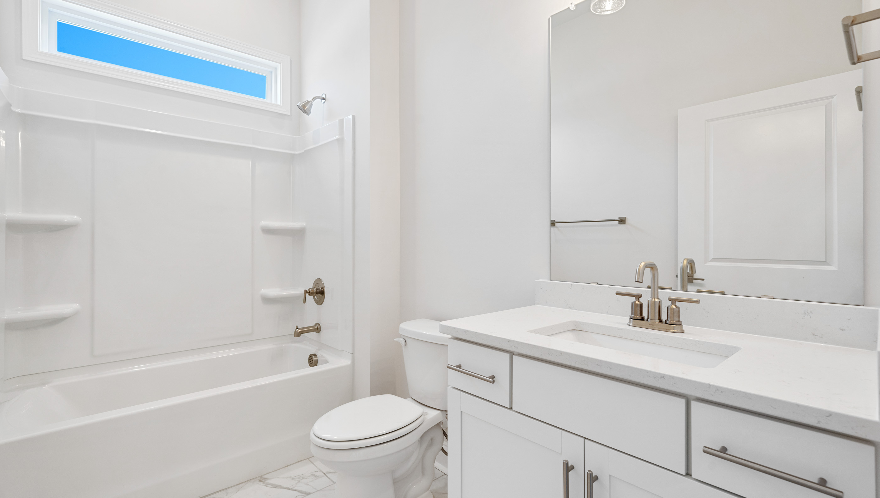 Bathroom with sink and shower.