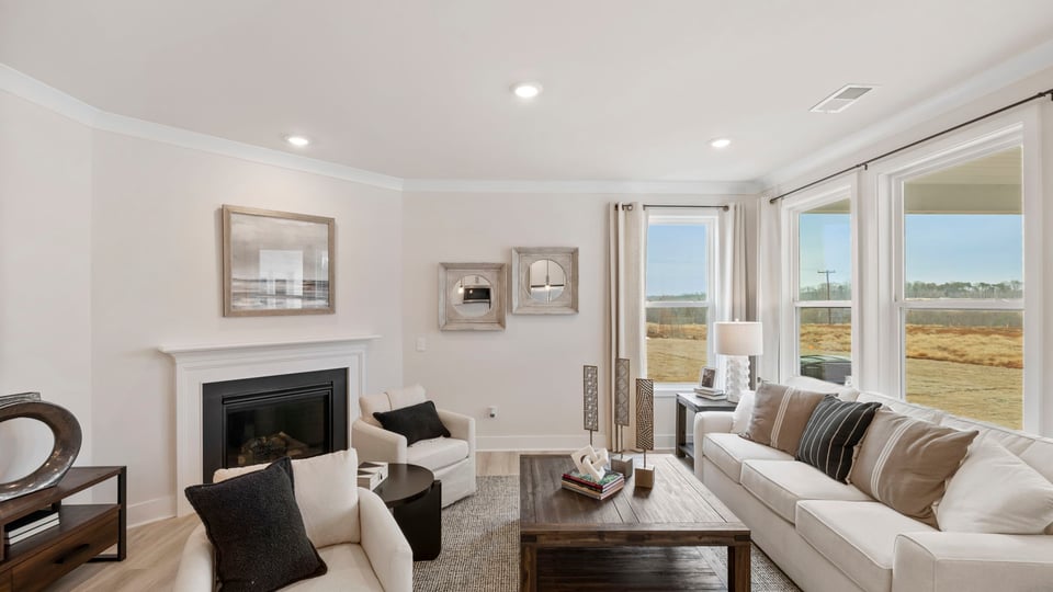 Family room with fireplace and windows.