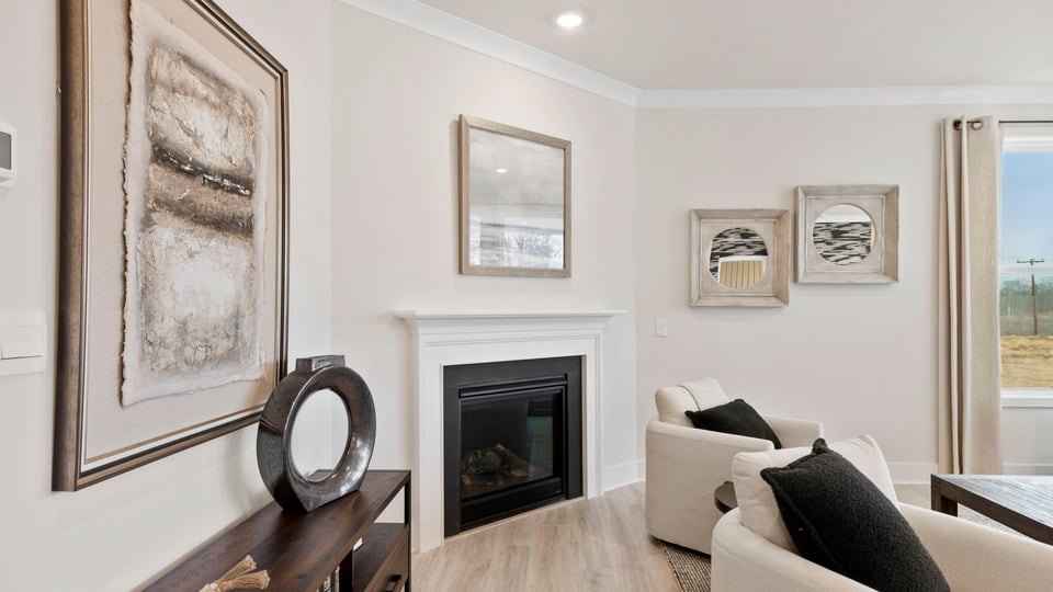 Family room with fireplace and windows.