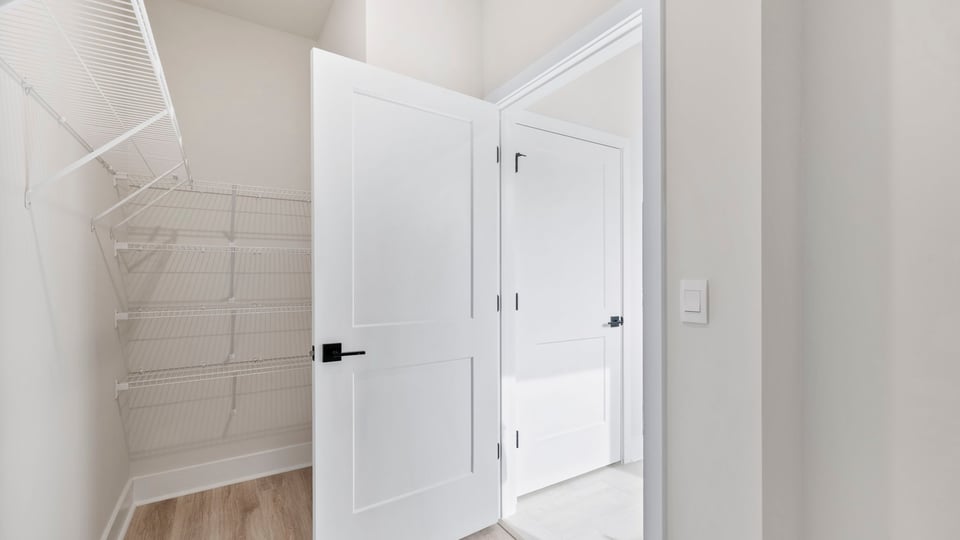 Closet with hanging storage racks.