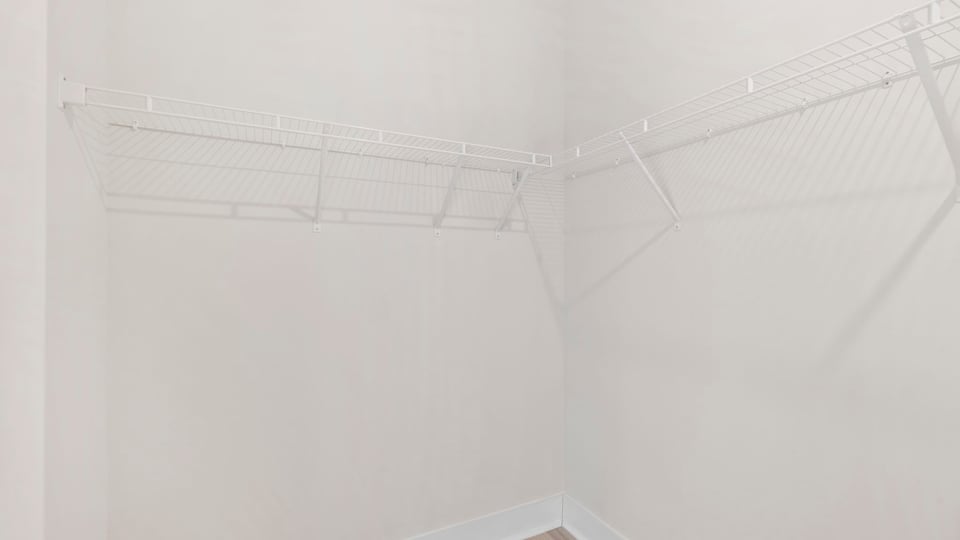 Closet with hanging storage racks.