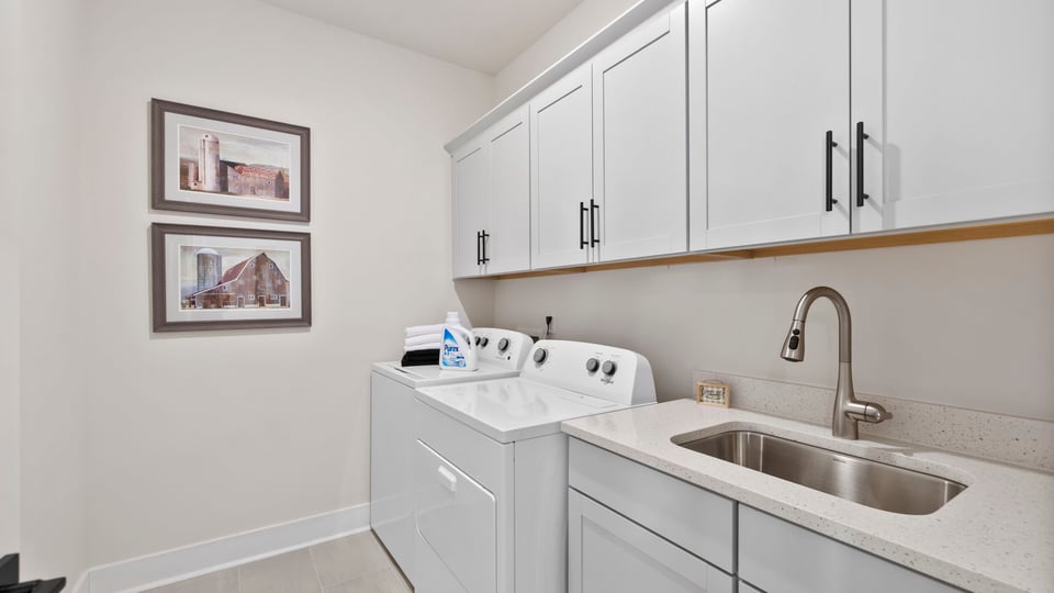 Laundry room with cabinets.