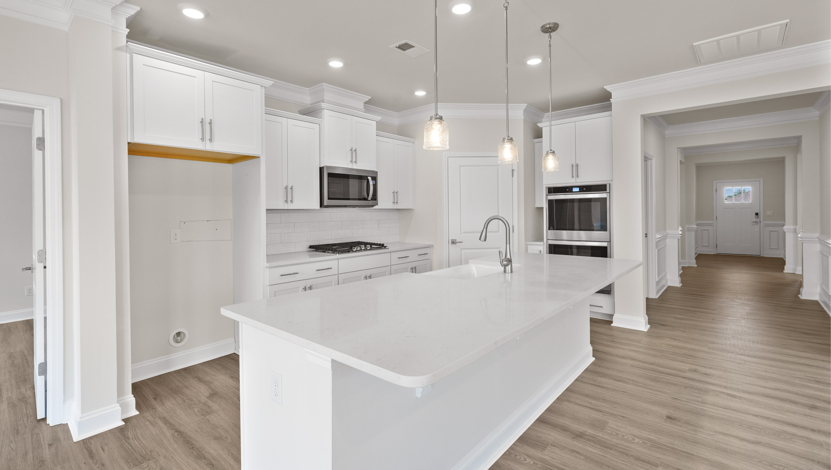 Kitchen and island with granite counter tops.