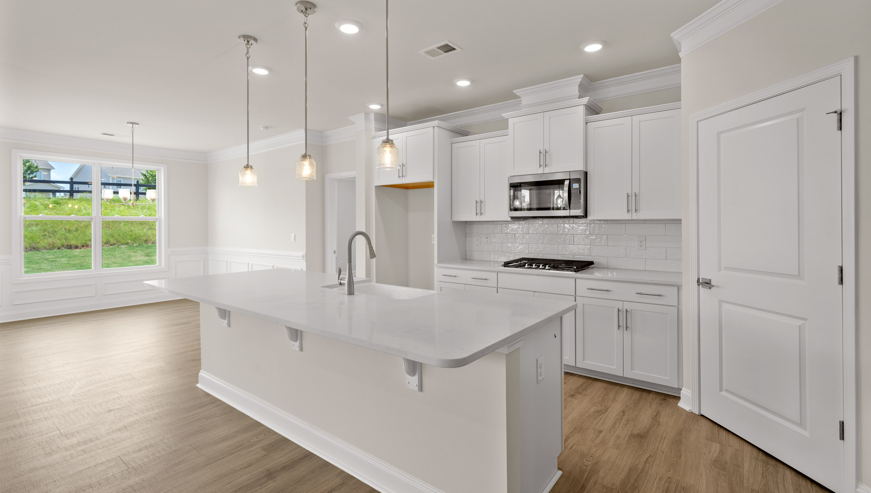 Kitchen and island with granite counter tops.