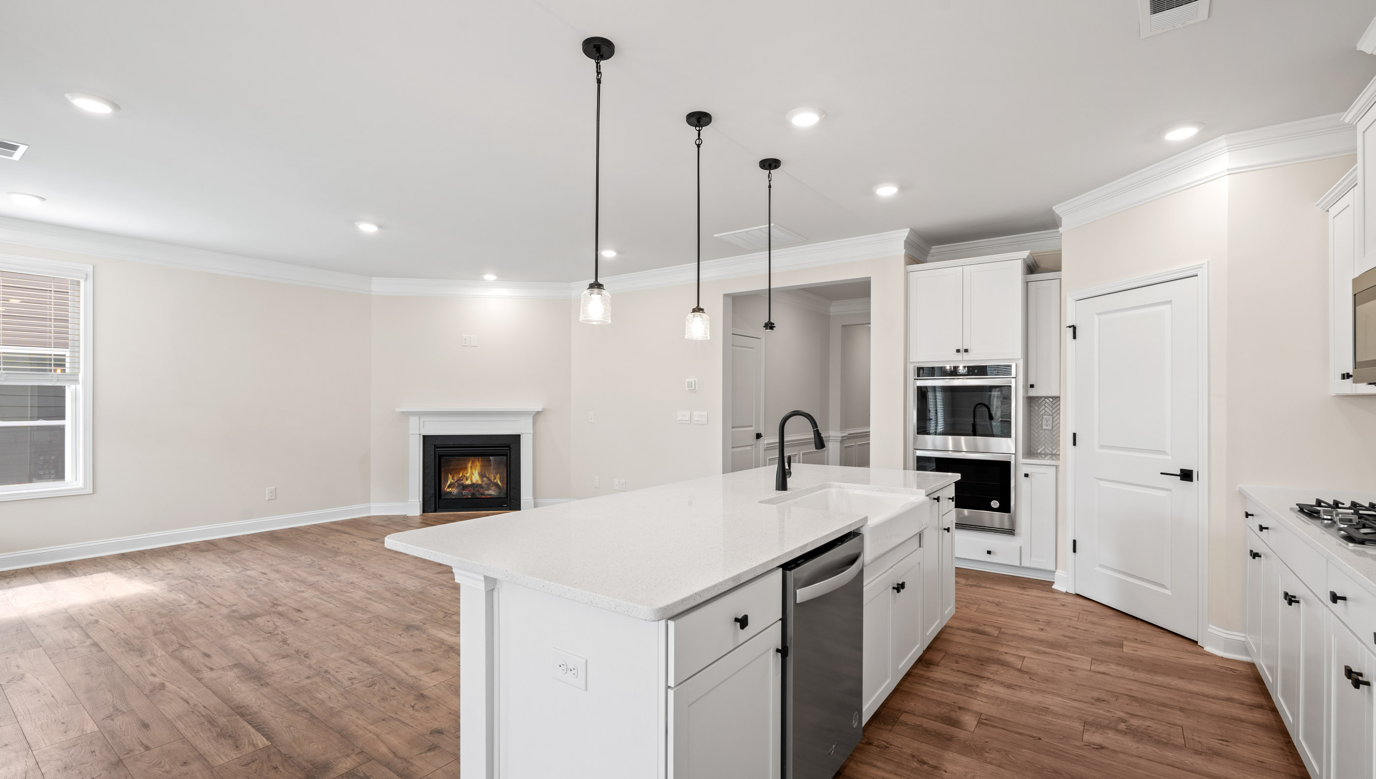Kitchen and island with granite counter tops.