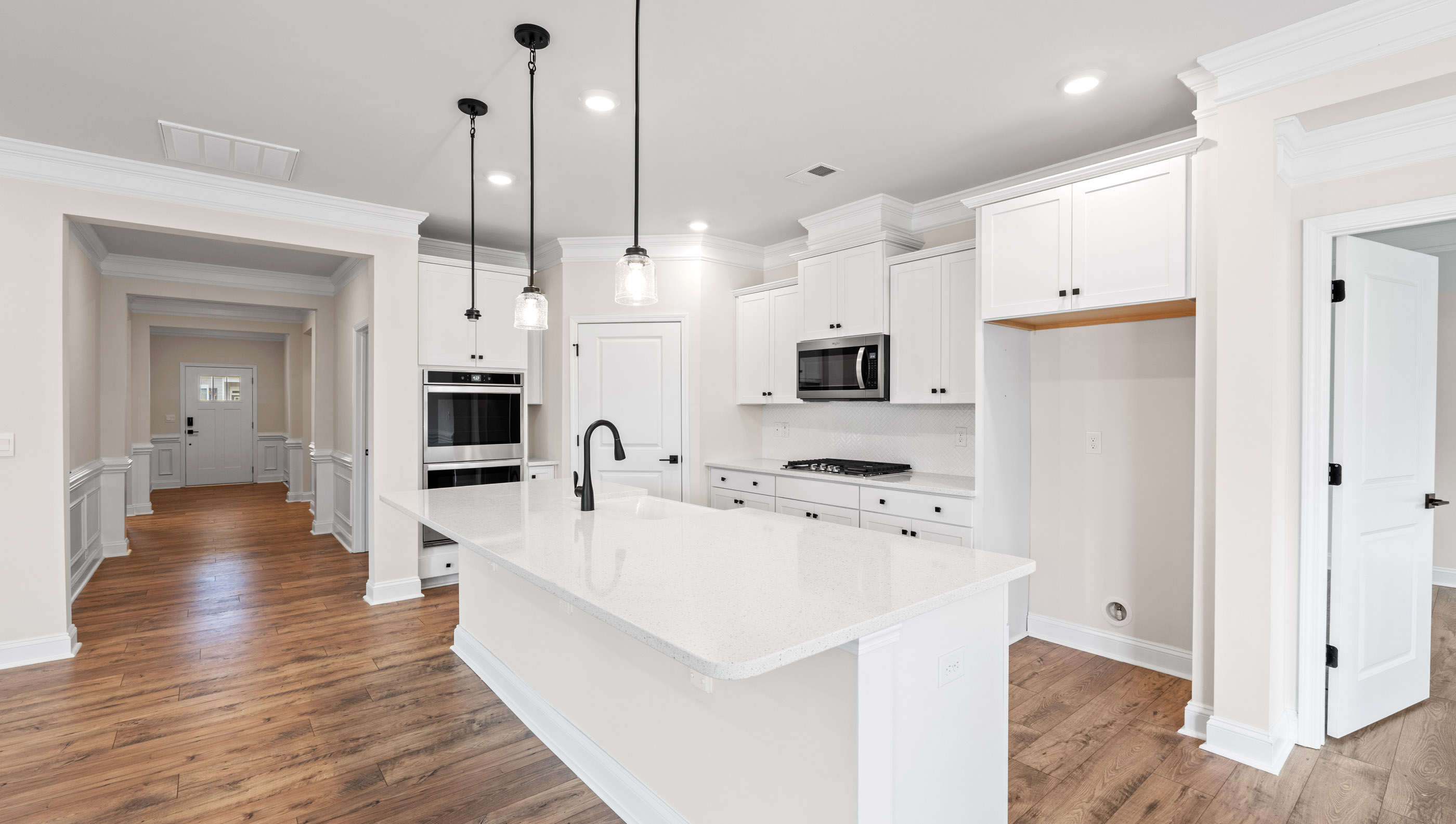 Kitchen and island with granite counter tops.