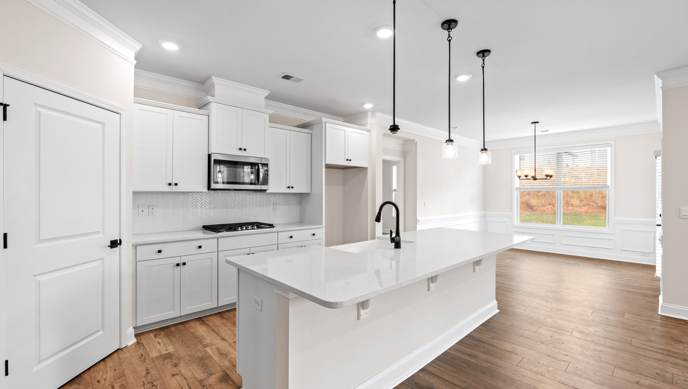 Kitchen and island with granite counter tops.