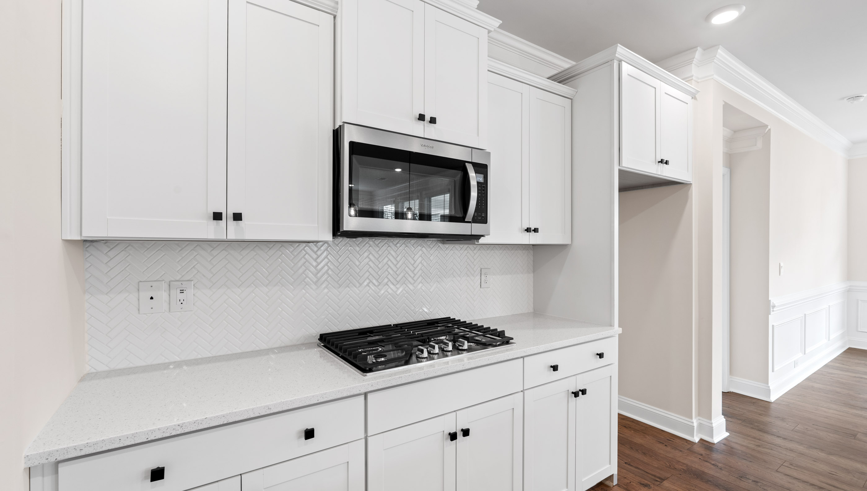 Kitchen and island with granite counter tops.