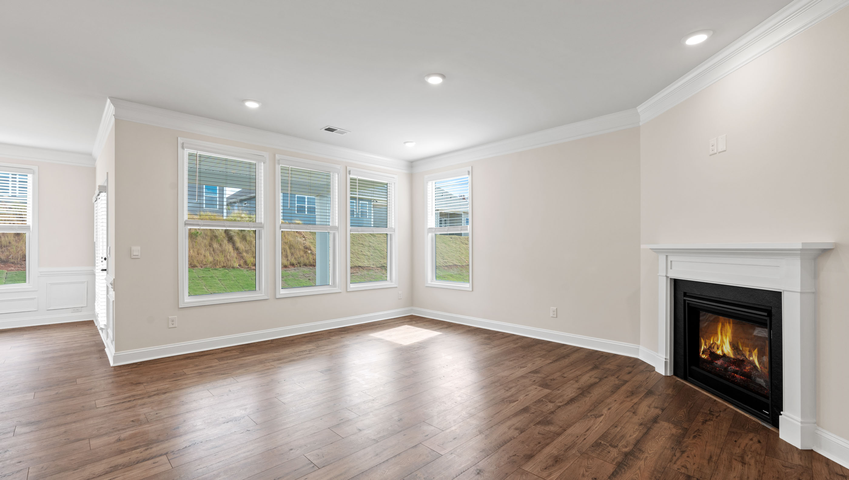 Family room with windows and fireplace.