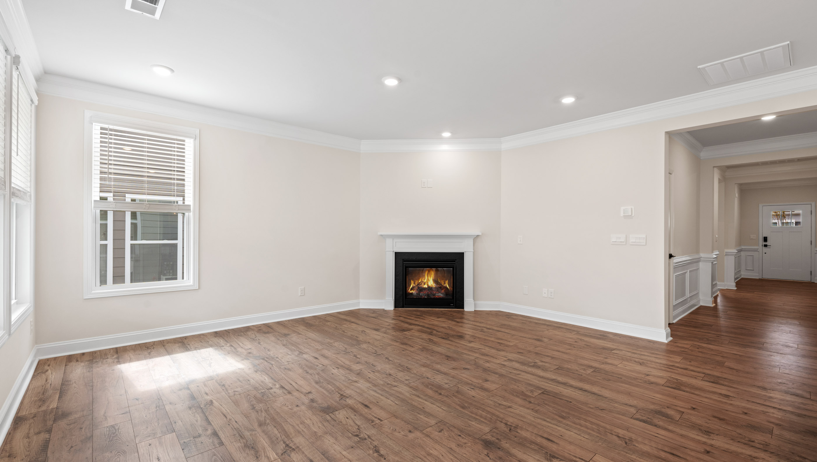 Family room with windows and fireplace.